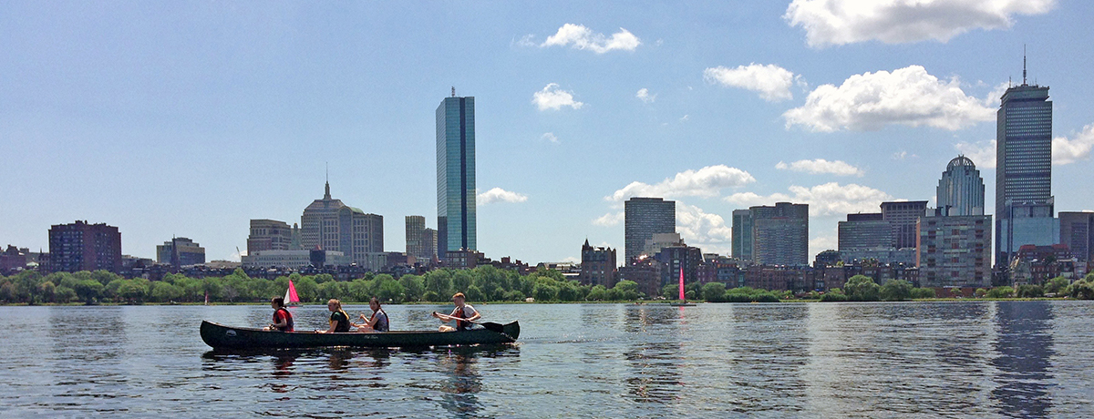 Summer Institute students canoeing on Boston's Charles River