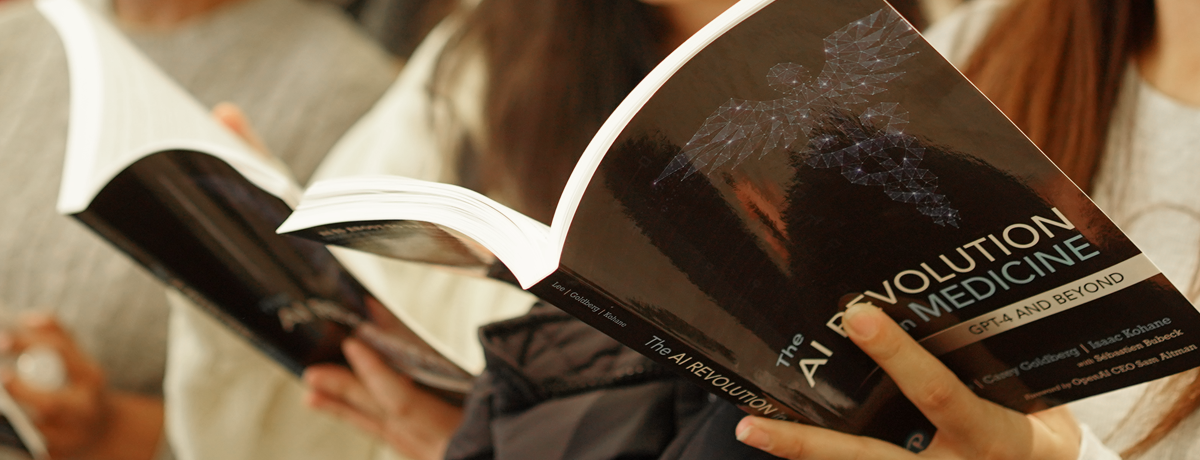students reading book The AI Revolution in Medicine: GPT-4 and Beyond