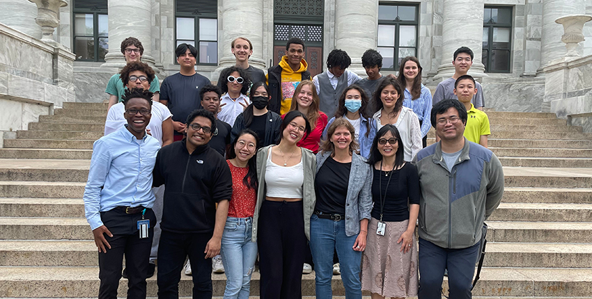 The Boston contingent of the 2023 CELEHS/HMS Data Science in Action Summer Program poses together on the steps of Harvard Medical School's Gordon Hall