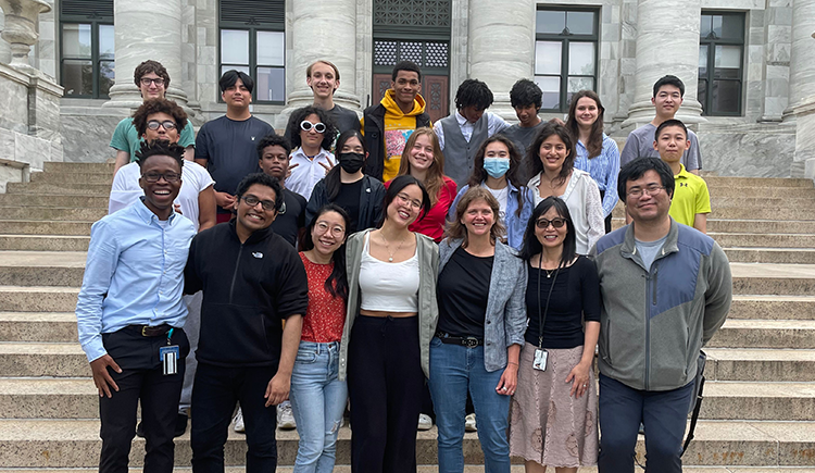 The Boston contingent of the 2023 CELEHS/HMS Data Science in Action Summer Program poses together on the steps of Harvard Medical School's Gordon Hall