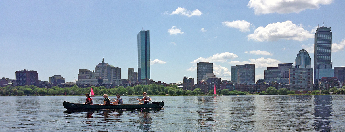 Summer Institute students canoeing on Boston's Charles River