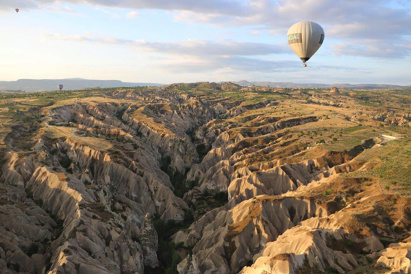 Photo of landscape with hot air balloons courtesy Mashaal Sohail